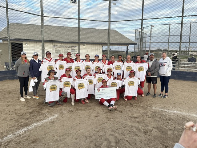 Youth baseball team celebrating championship victory on field